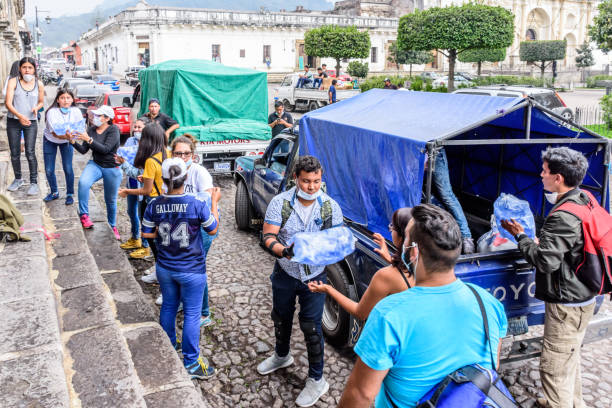 Antigua,, Guatemala -  June 5, 2018:  Volunteers load supplies outside town hall to take to area affected by eruption of Fuego (fire) volcano on June 3. Currently official figures say 121 people died & 300 missing.